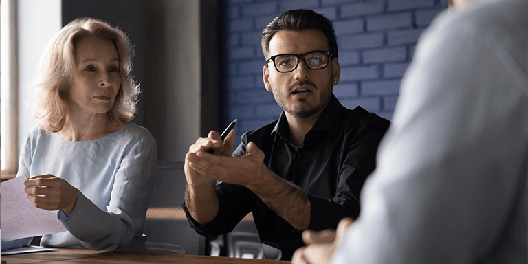Man and Woman Talking to Another Person